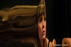 Portrait of a female model reflected - hair streaming out